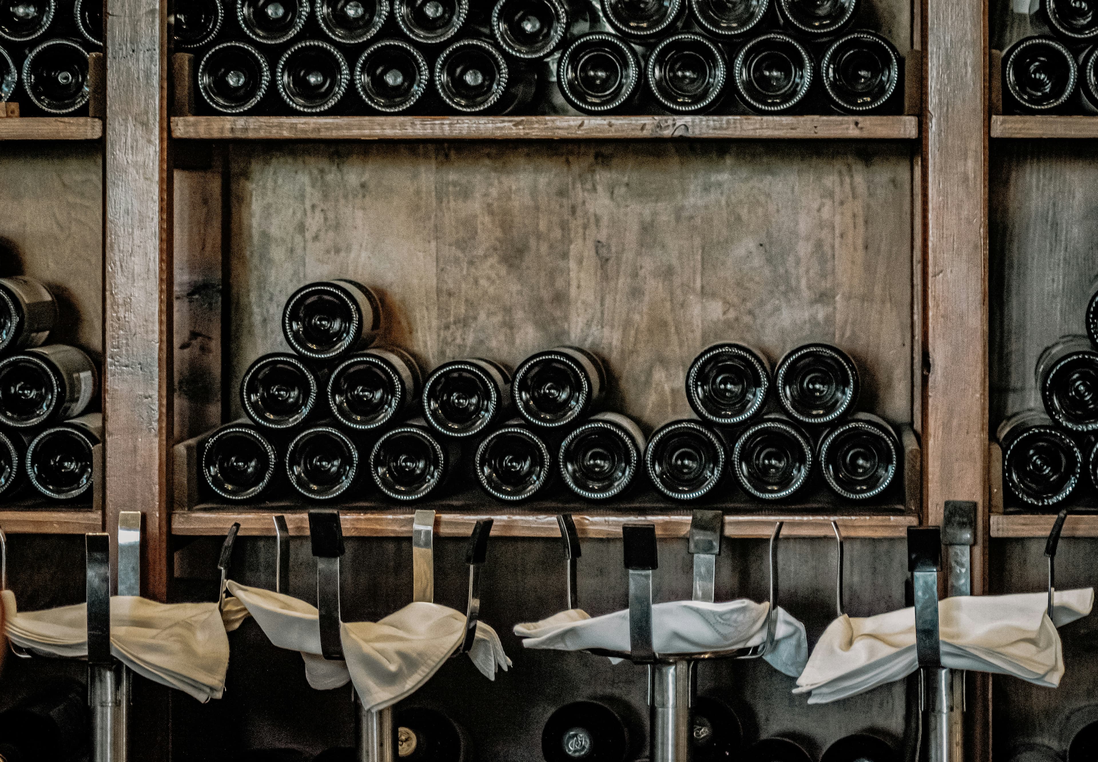 Premium wine bottles stored on wooden racks