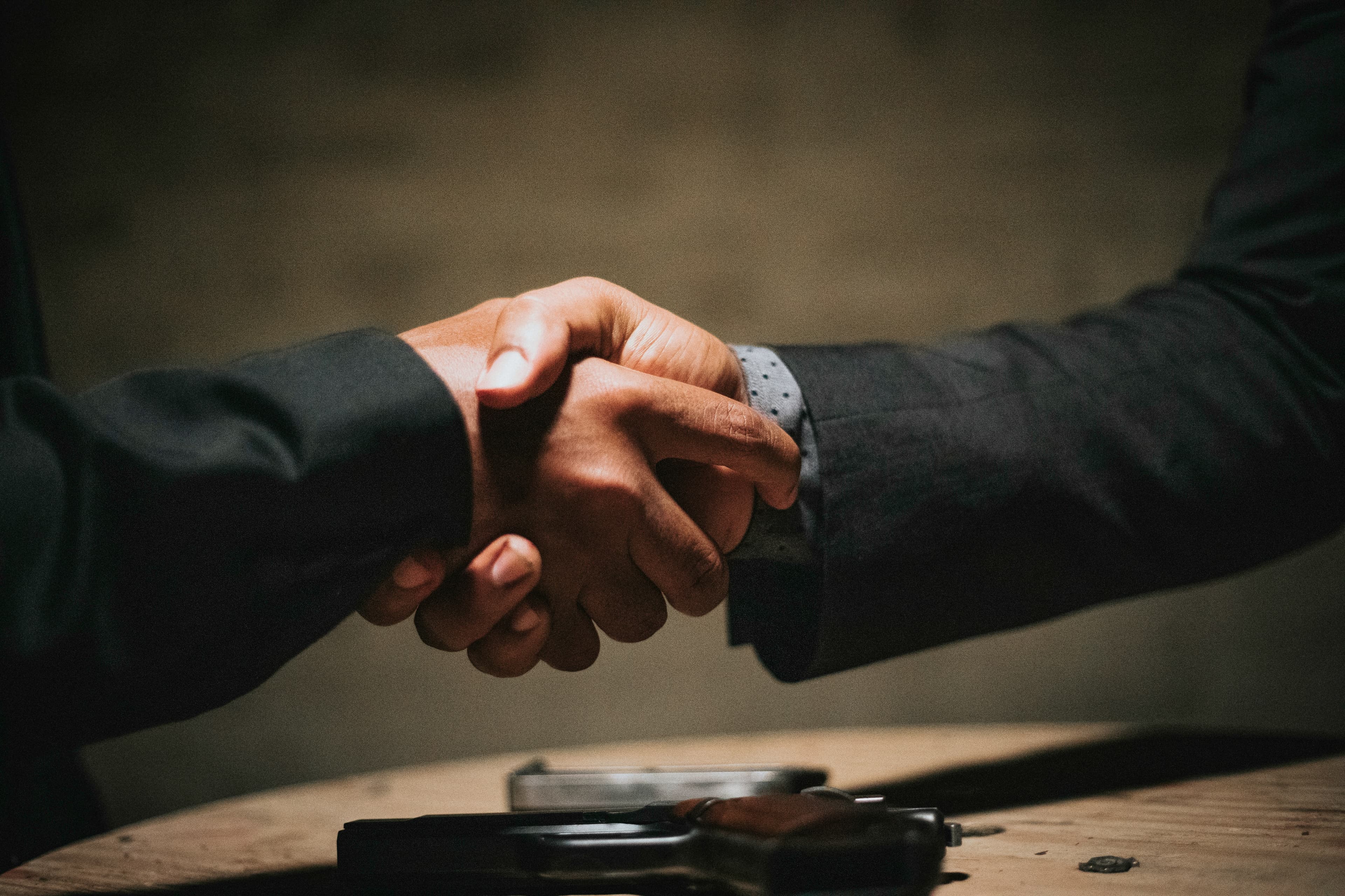 Business partnership handshake
